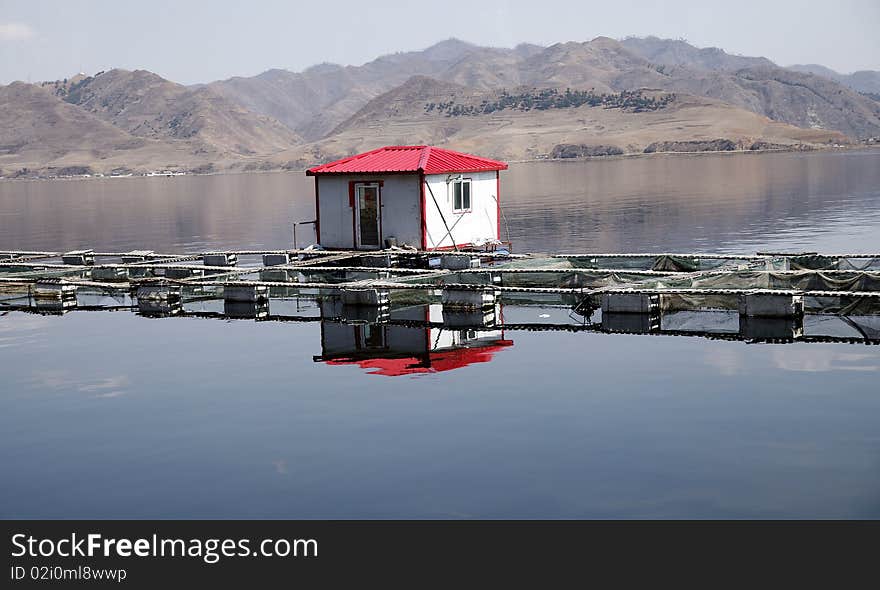 Fishermen with fish cage culture on the lake. Fishermen with fish cage culture on the lake.