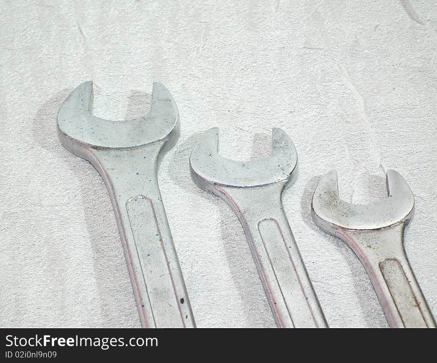 Chrome wrench set on white background in three sizes