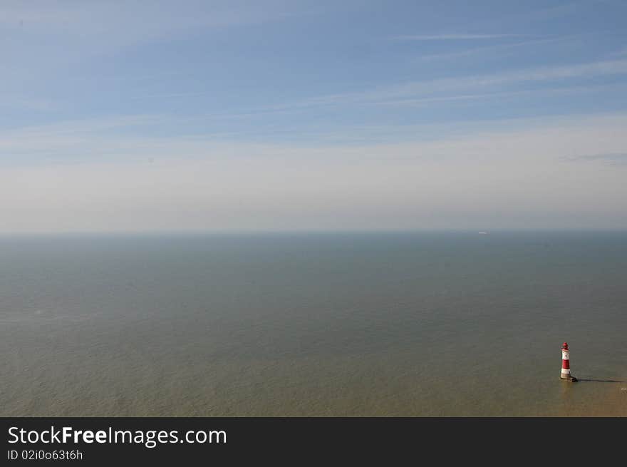 The famous lighthouse looks out over miles of empty sea. The famous lighthouse looks out over miles of empty sea