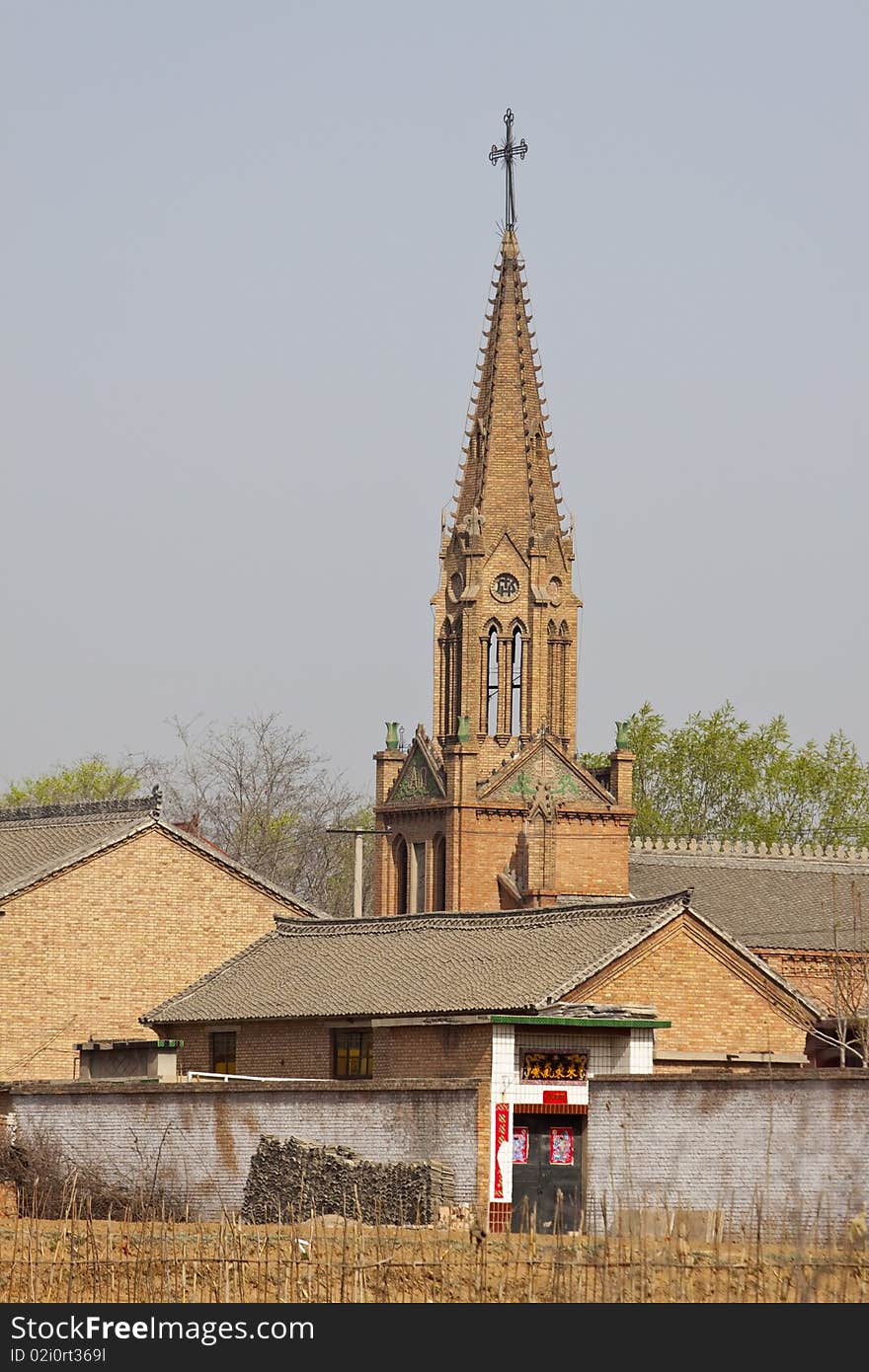 The little brick Catholicism church in the little village of China. The little brick Catholicism church in the little village of China