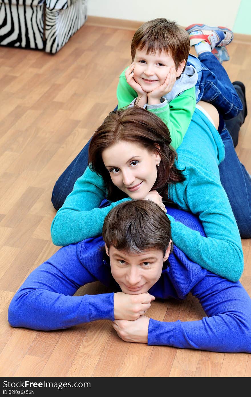 Happy family with a child at home. Happy family with a child at home.