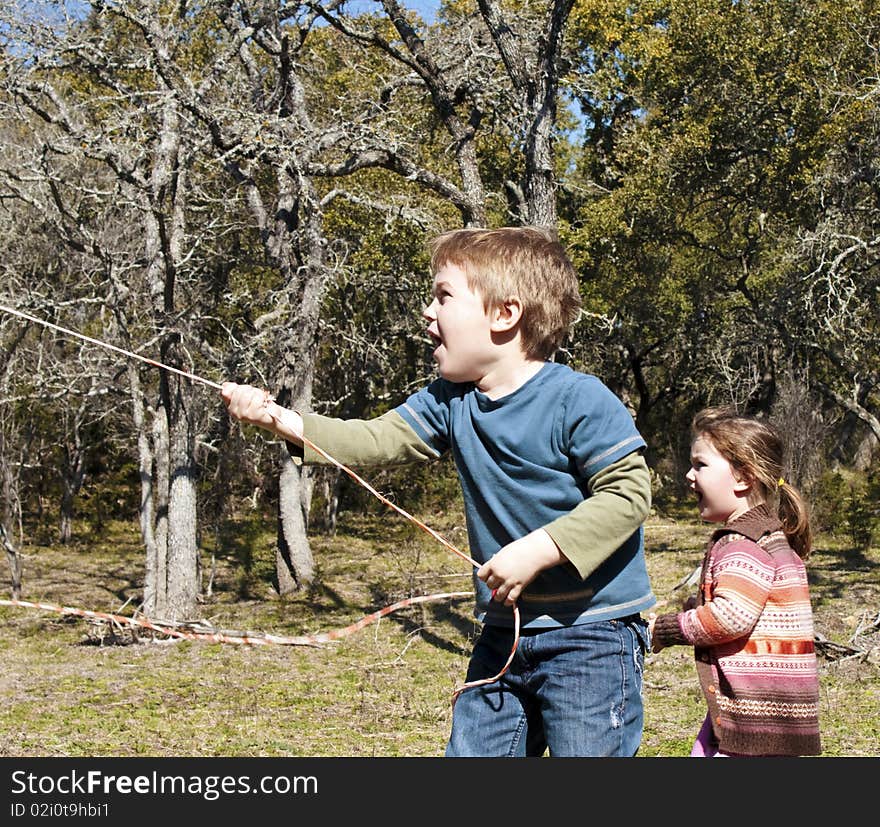 A boy and a girl showing surprise in outdoors. A boy and a girl showing surprise in outdoors