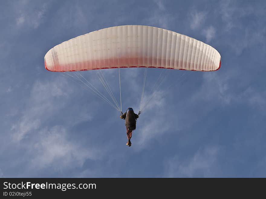 Paraglider On Blue Sky