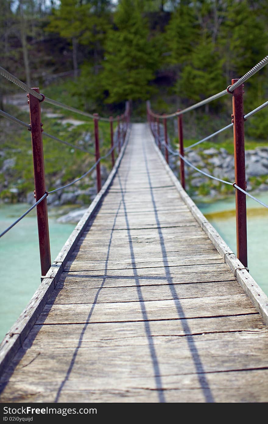 Hanging wooden bridge over a river