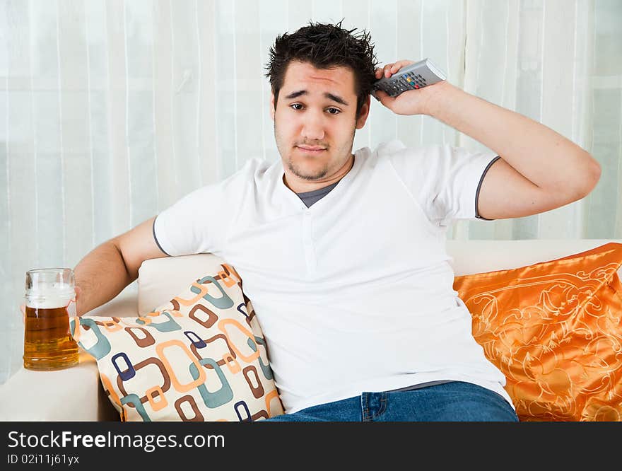 Young Boy Watching Football In The Television