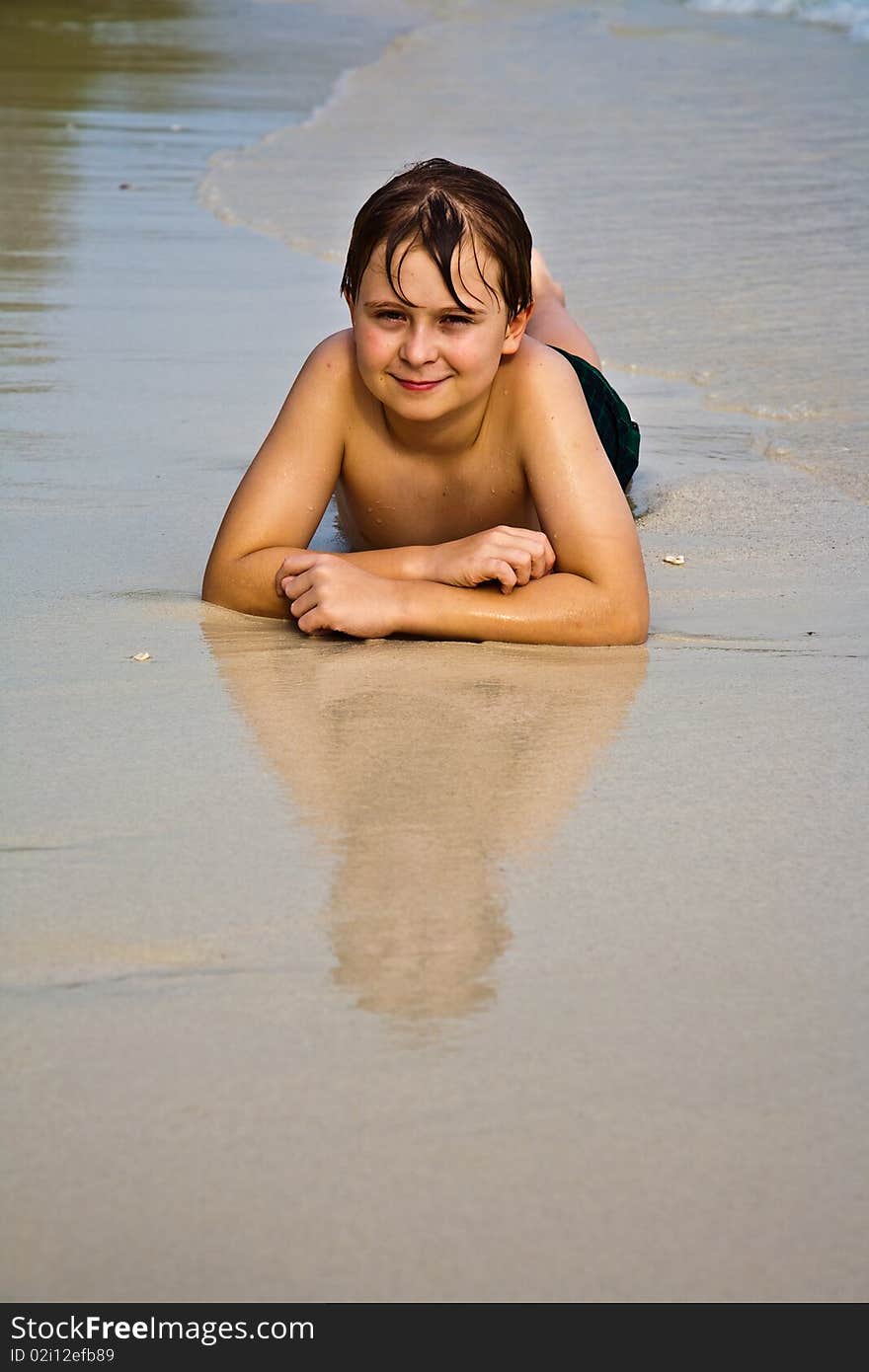 Young happy boy at the beach