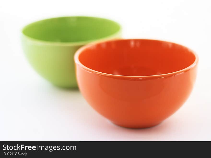 Multi-coloured cups on a white background