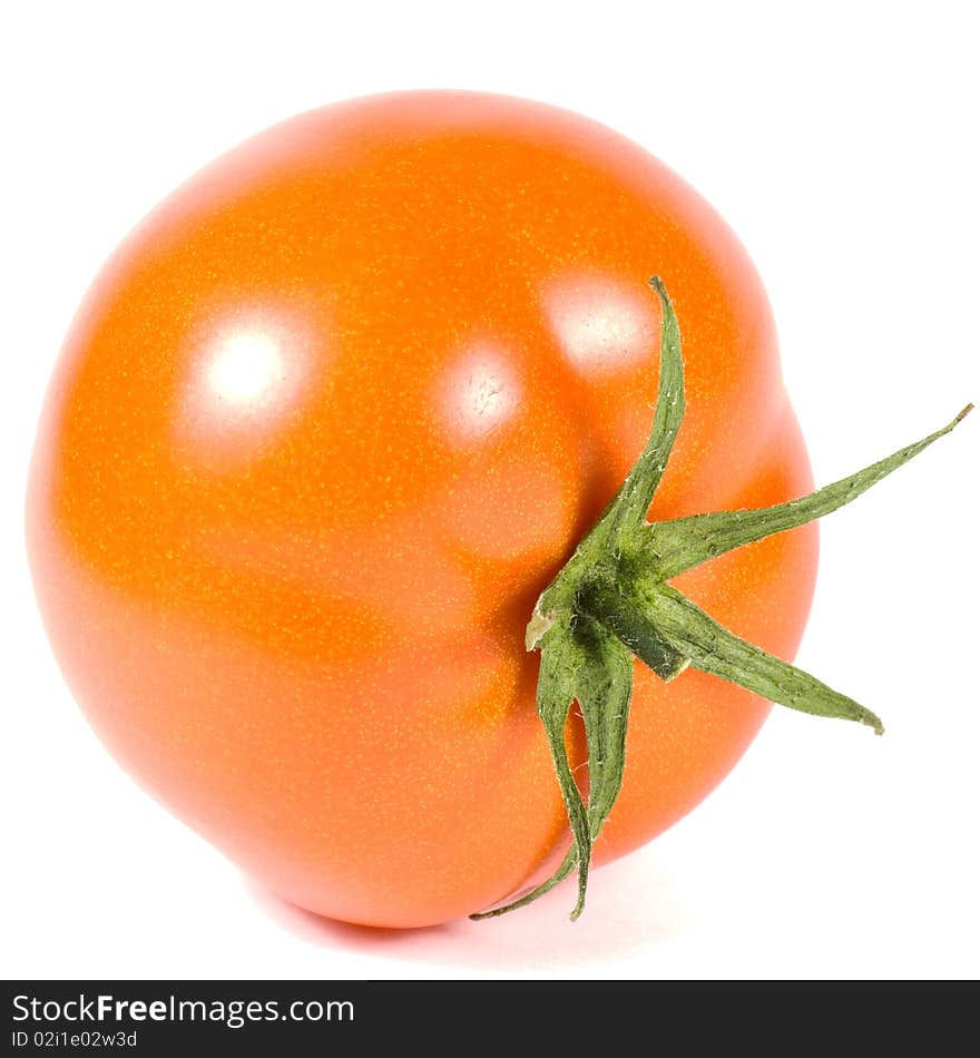 One red tomato is isolated on a white background