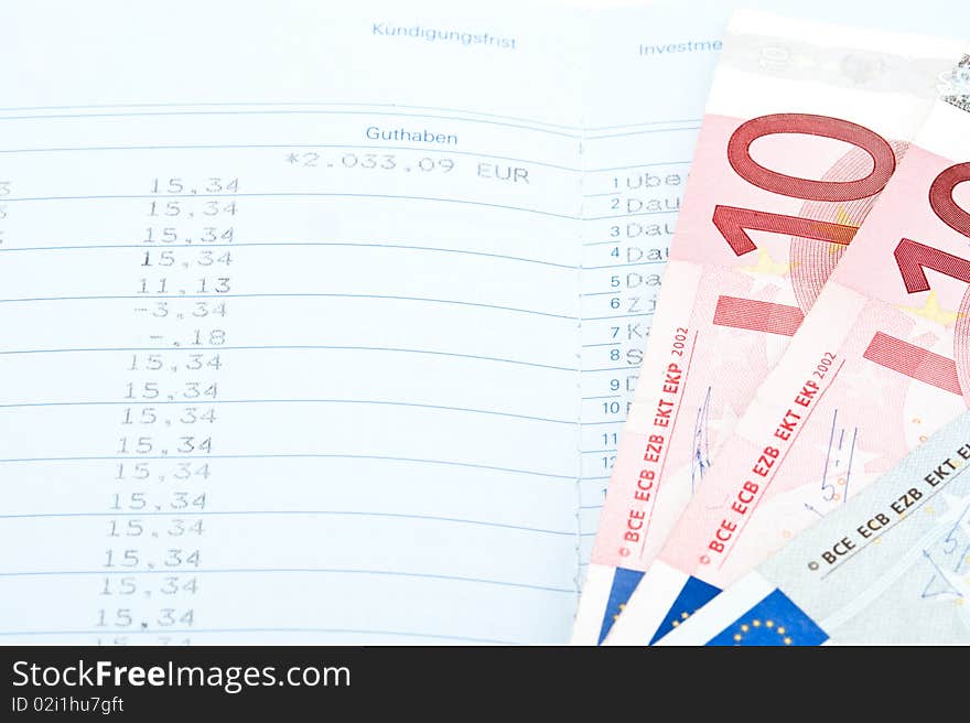 Close-up of savings in money and bank statement. Close-up of savings in money and bank statement