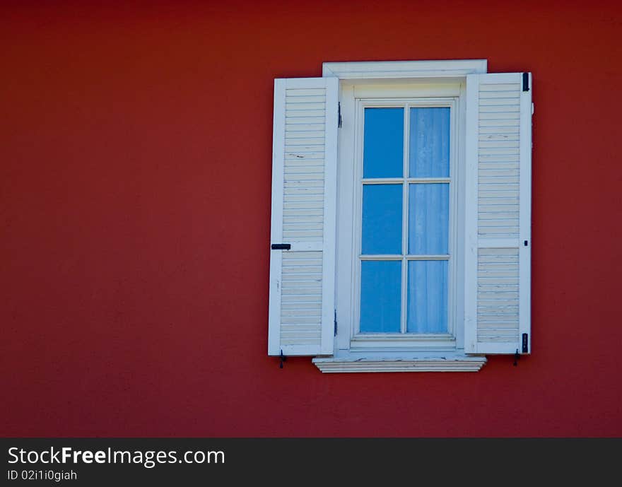 Small white framed window on country house