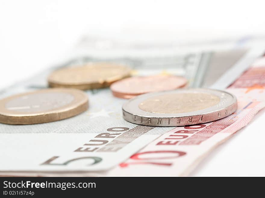 Close-up of euro coins and banknotes