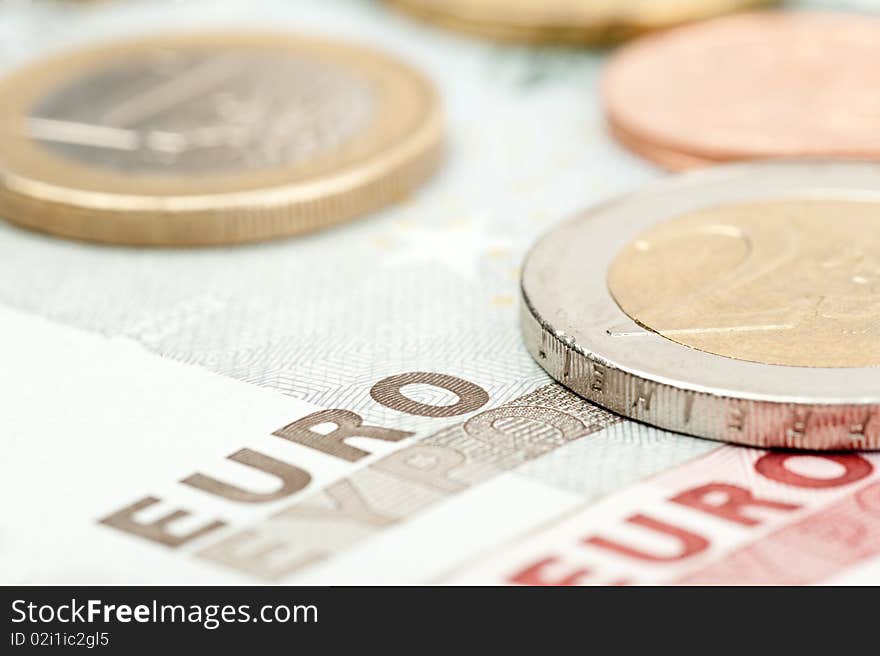 Close-up of euro coins and banknotes