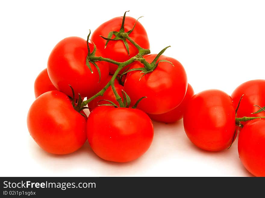 A few red tomatoes isolated on white. A few red tomatoes isolated on white