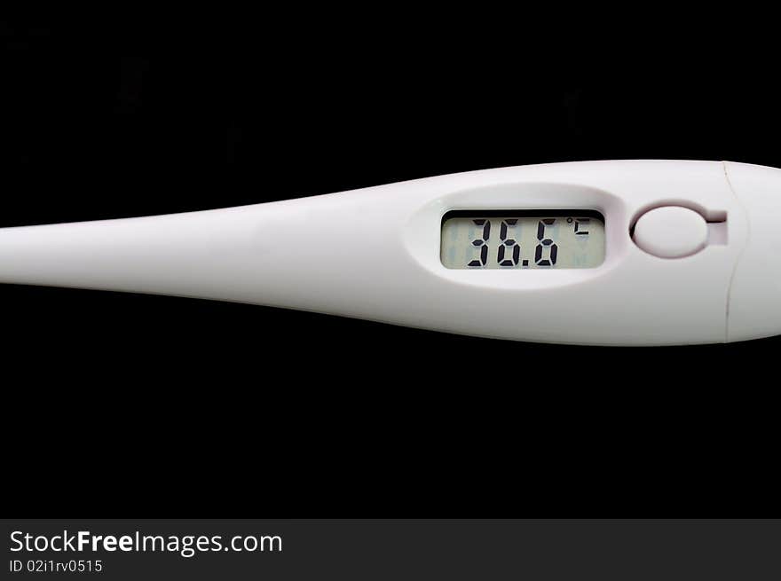 The digital thermometer, showing normal temperature of 36.6 degrees on Celsius. The digital thermometer, showing normal temperature of 36.6 degrees on Celsius.