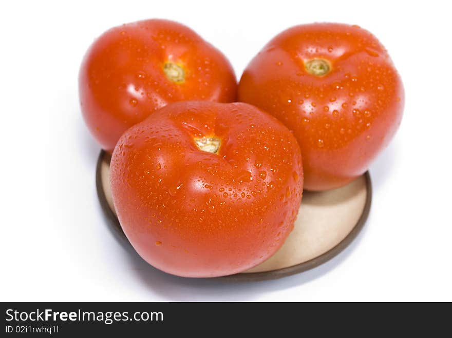 Ripe tomatoes on a plate