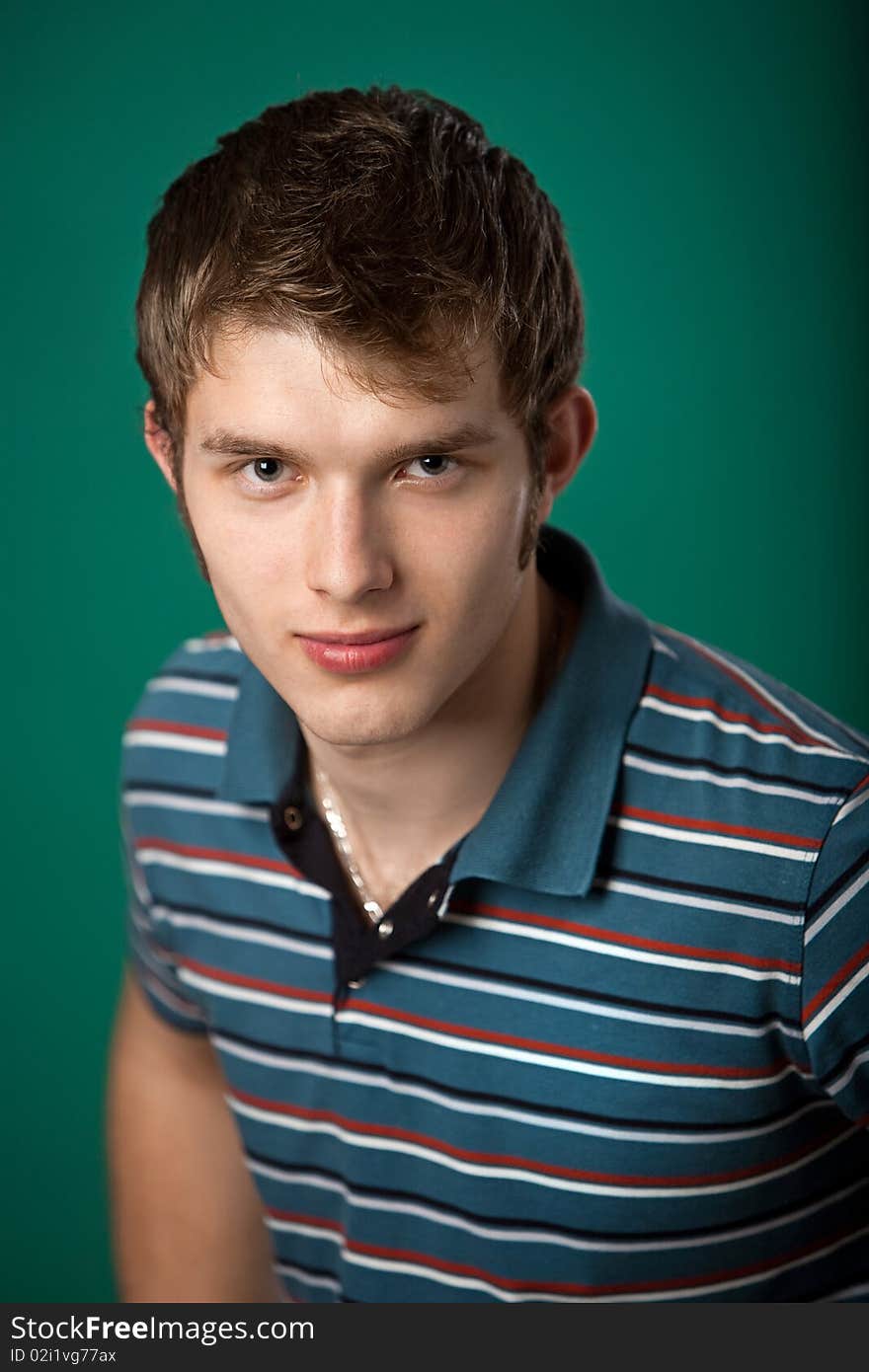 Young guy on a green background