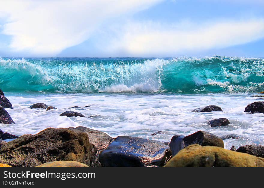 This is a photo of blue ocean and sky with clouds