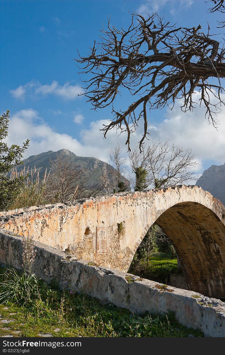 Old arched Venetian Bridge at Preveli in Crete, Greece