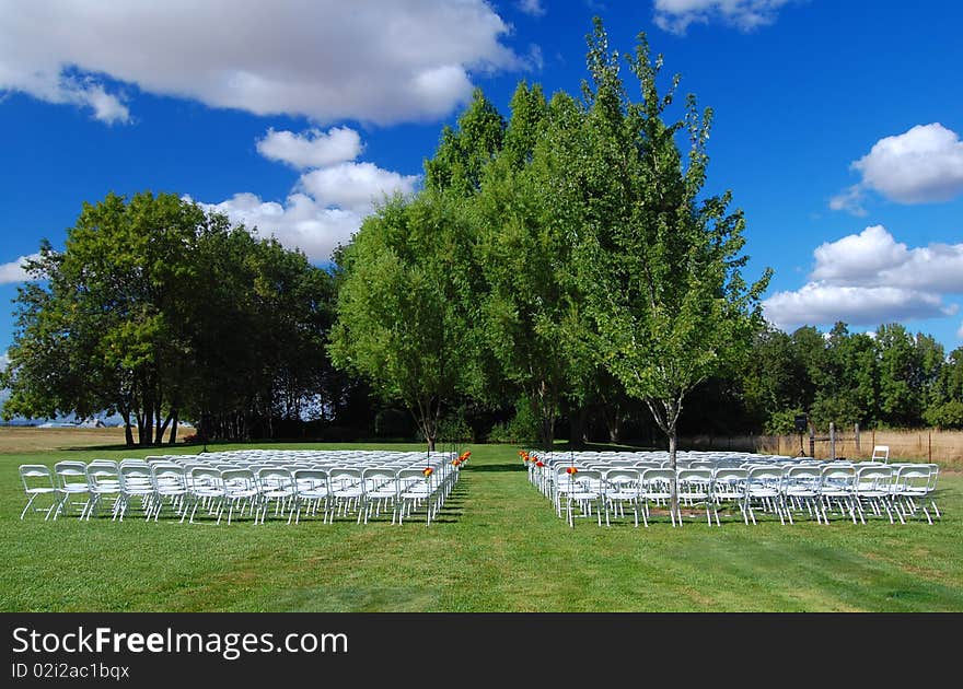 A lovely green grass wedding aisle in a rural setting. A lovely green grass wedding aisle in a rural setting.