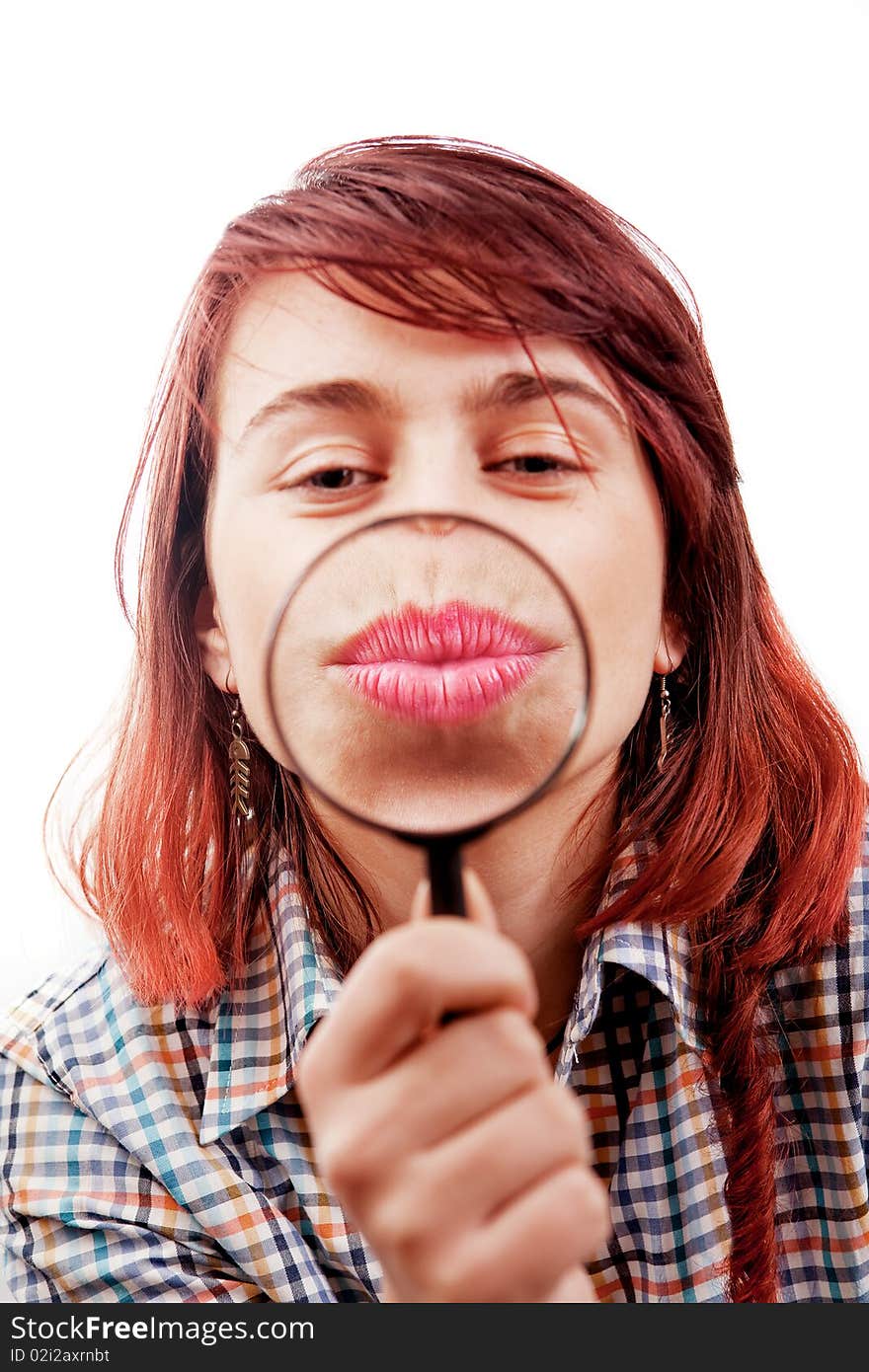 Kiss of funny woman and magnifying glass