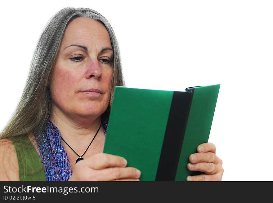 Woman reading a green hardcover book isolated on white background with room for your text. Woman reading a green hardcover book isolated on white background with room for your text