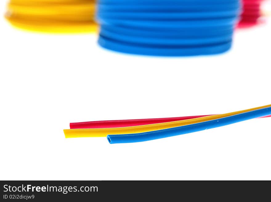 Red, dark blue and yellow wires of retinue in rings for storage.