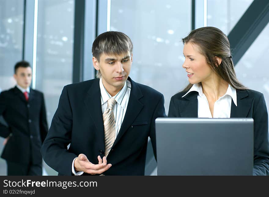 Two Young business colleagues are working together in a modern office. Two Young business colleagues are working together in a modern office.