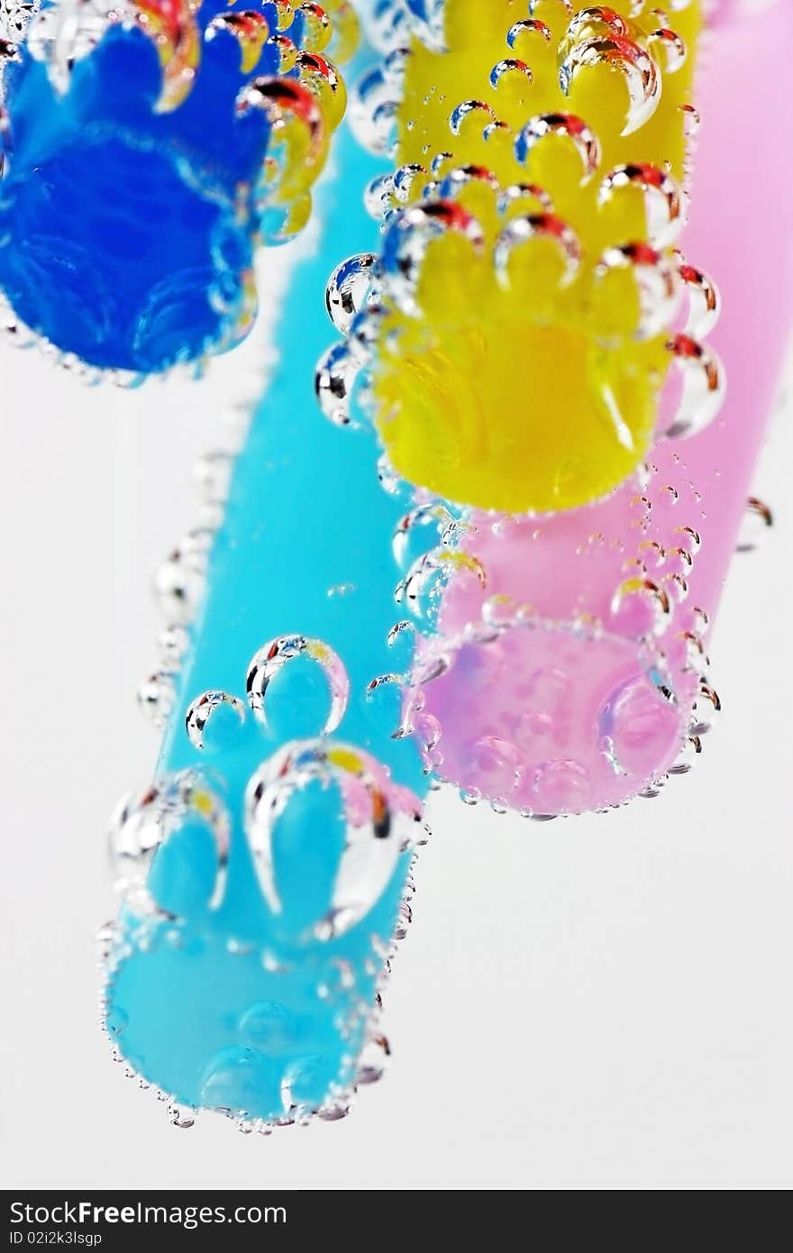 Colorful straws in soda beverage with bubbles. Colorful straws in soda beverage with bubbles