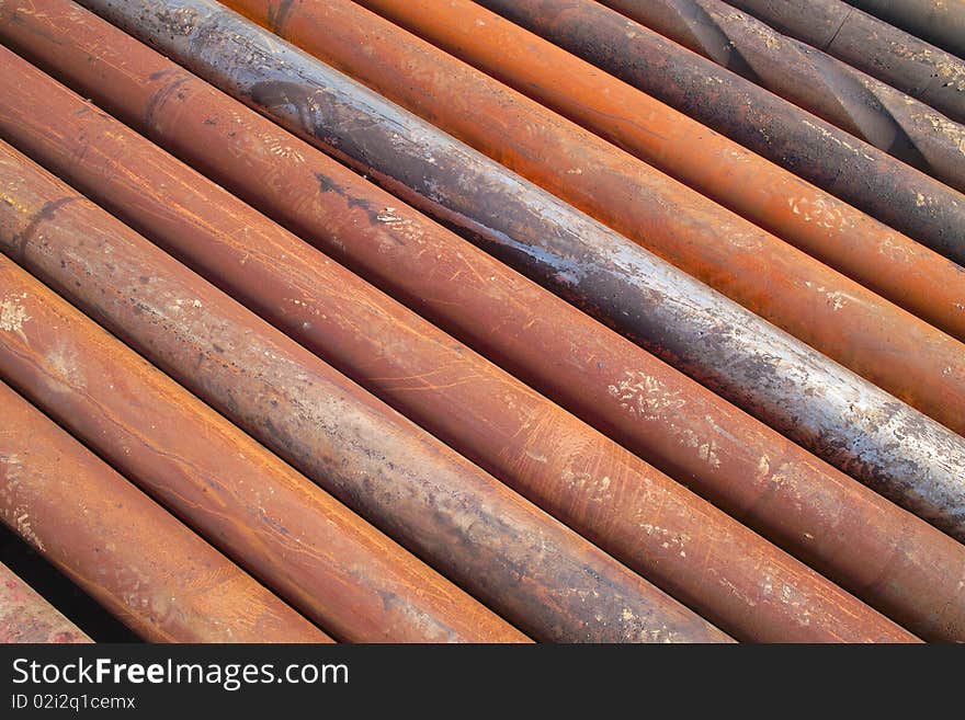 Rusty drilling pipe arranged together