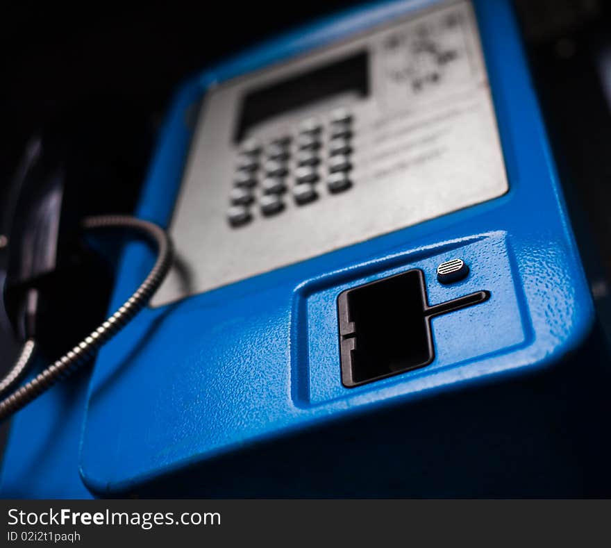 New blue public phone close-up shot. New blue public phone close-up shot