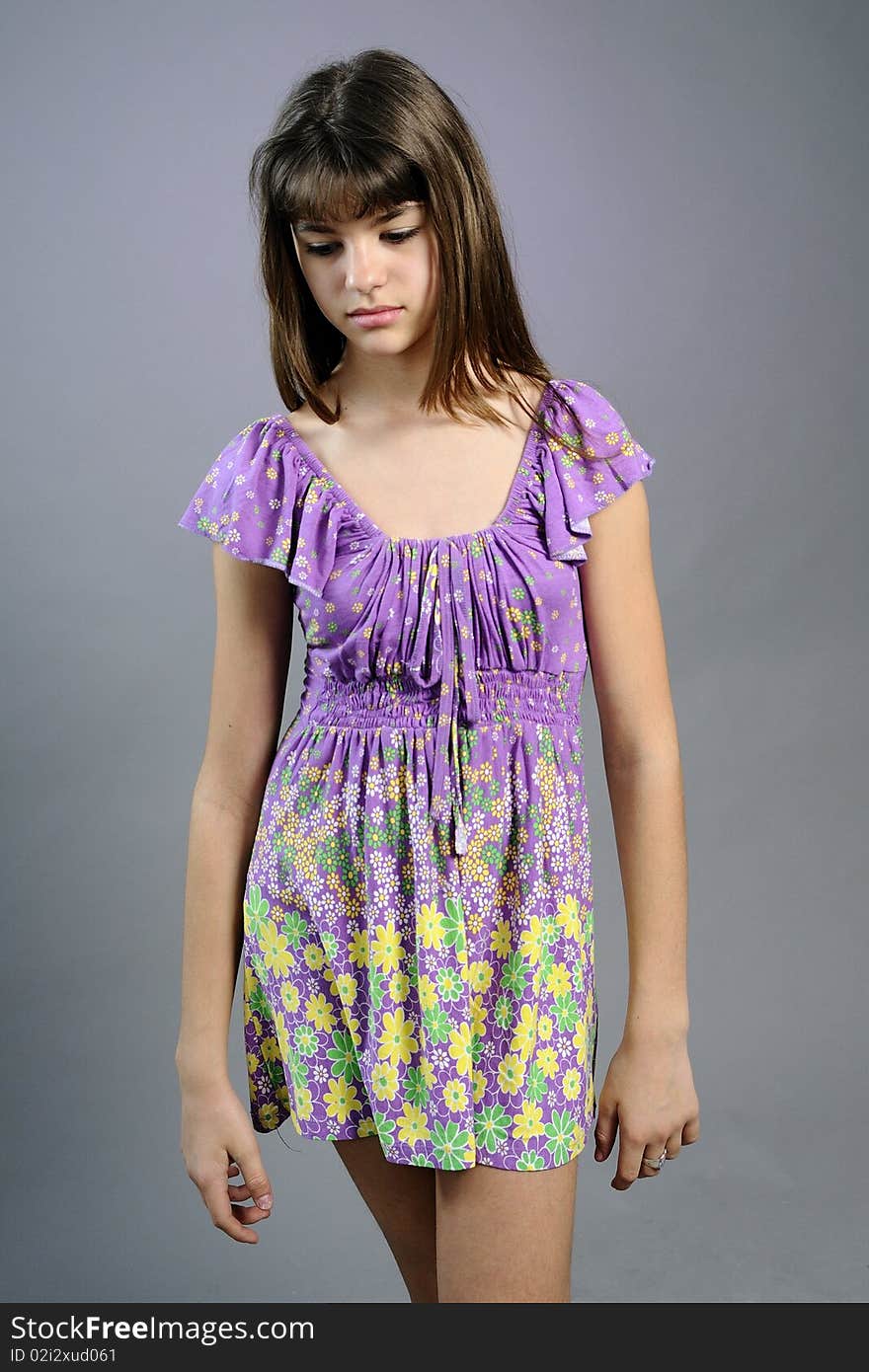 White girl expressing loneliness and posing with dress in studio. White girl expressing loneliness and posing with dress in studio