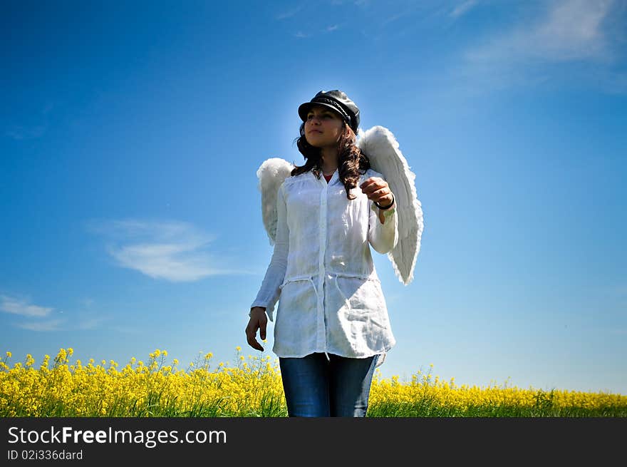 Happy girl with angel wings walking