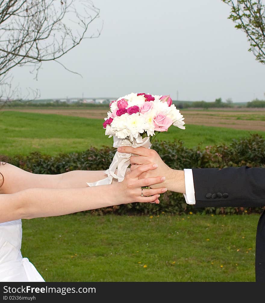 Shot of flower that is hold by bride and groom. Shot of flower that is hold by bride and groom