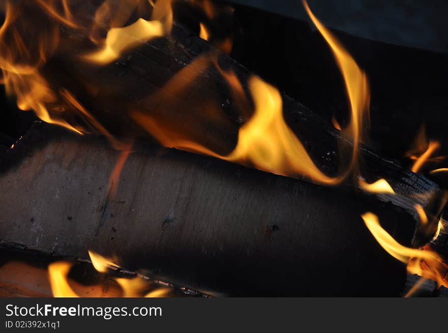 Picture of logs in flame of fire which burn out. Picture of logs in flame of fire which burn out