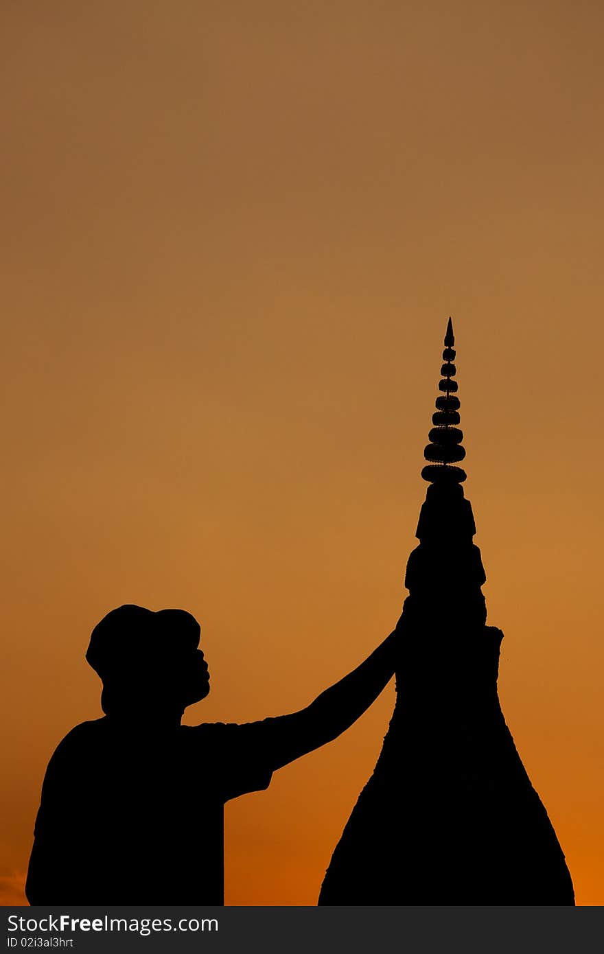 Man and Buddha's Relics at sunset. Man and Buddha's Relics at sunset