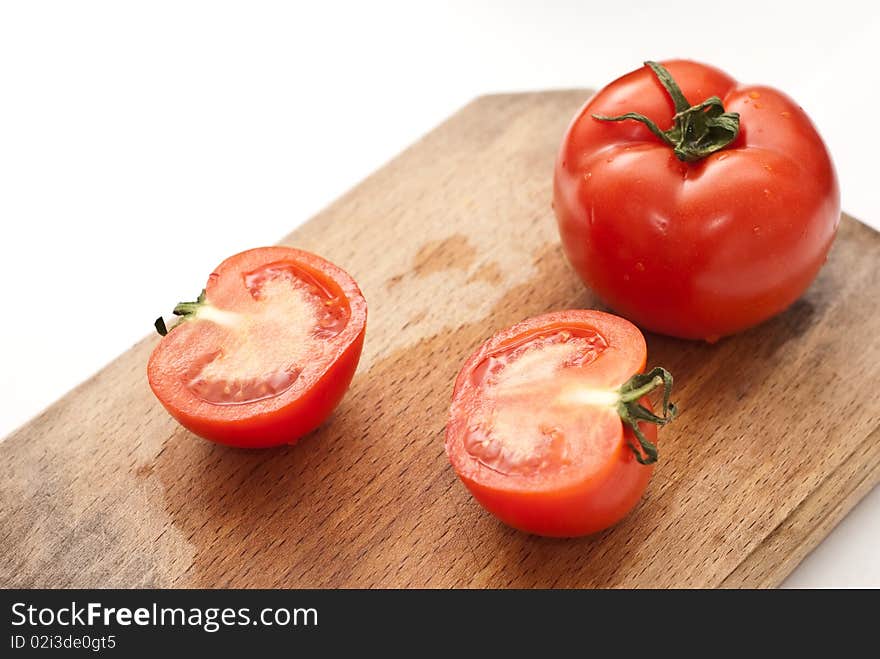 Fresh tomatoes on a worktop