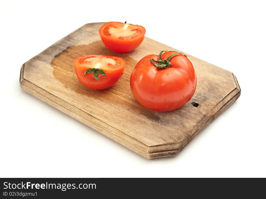 Fresh tomatoes on a worktop