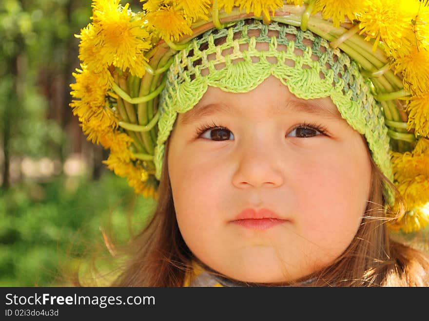 Portrait Of A Little Girl Wearing Dandelion Diadem