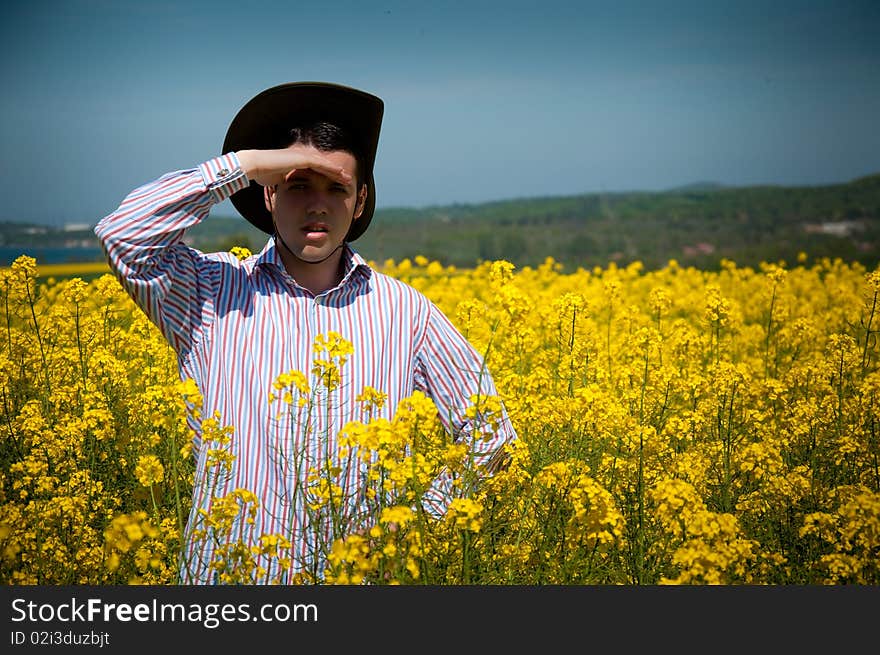 Young man in rape field enjoy