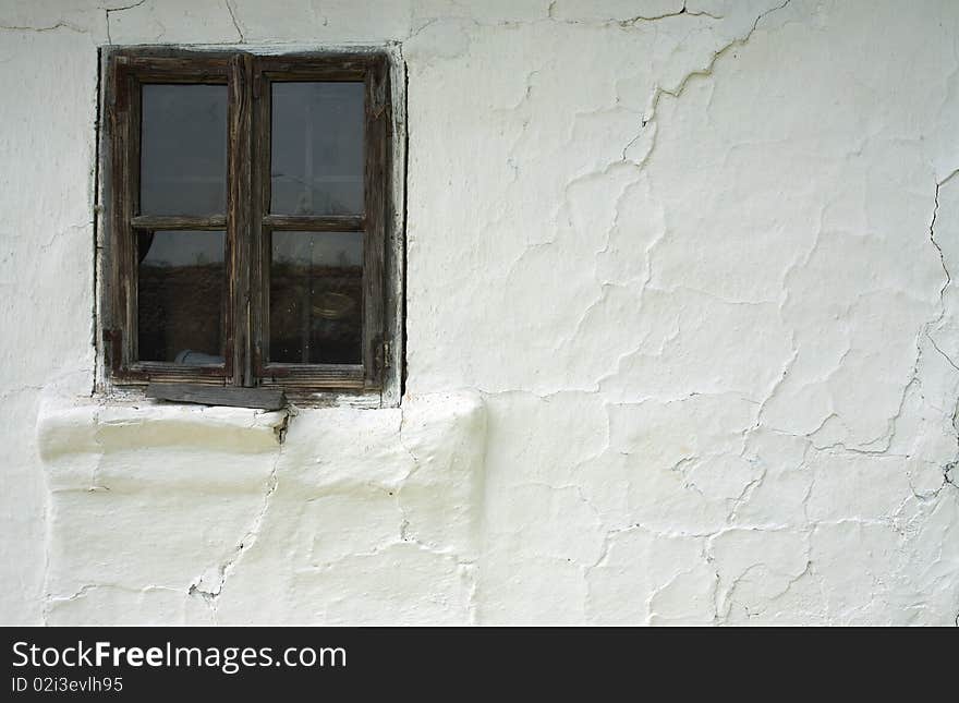 Details of an old window on white wall. Details of an old window on white wall.