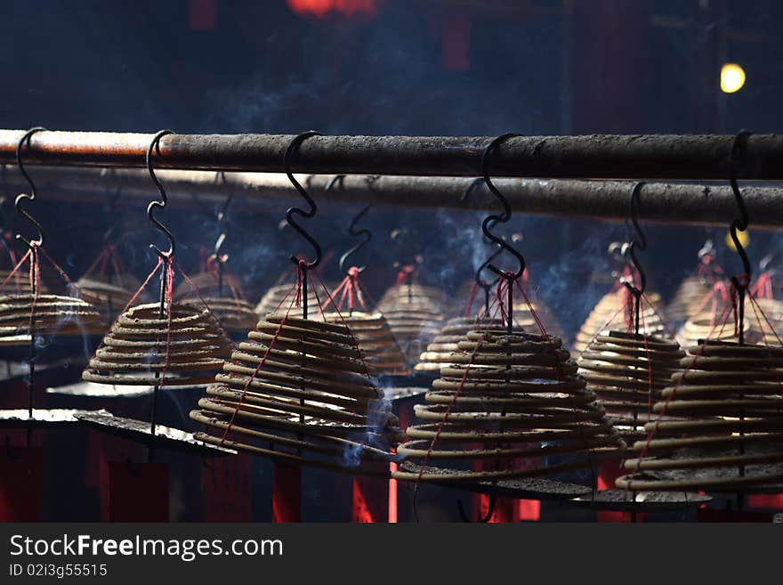 Incense tower in man mo temple. The Man Mo Temple is one of the oldest and most beautiful temples on Hong Kong island. Built in the 1800s, the temple is dedicated to two deities: Man, the god of literature, and Mo, the god of war.