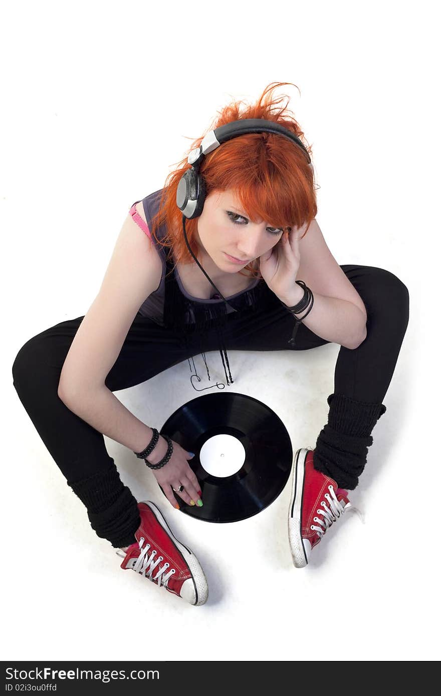 Punk girl with headphones and record. Punk girl with headphones and record