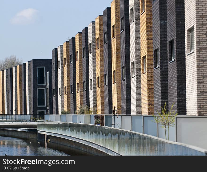 A row of new brick houses in contrasting colors. A row of new brick houses in contrasting colors.