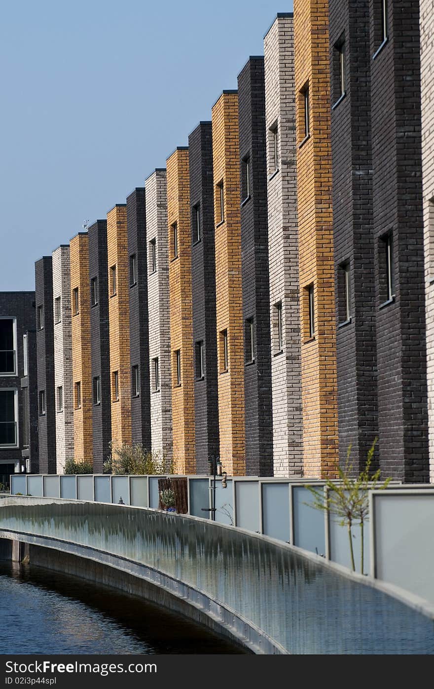 A row of new brick houses in contrasting colors. A row of new brick houses in contrasting colors.