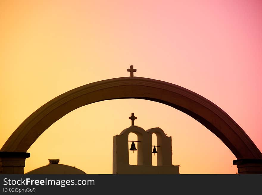 Greek church in santorini greece with a cross