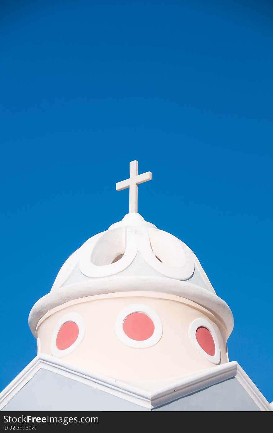 Greek church in santorini greece with a cross