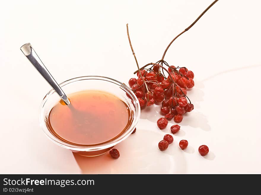 Food series: bowl with jam and viburnum  twig. Food series: bowl with jam and viburnum  twig