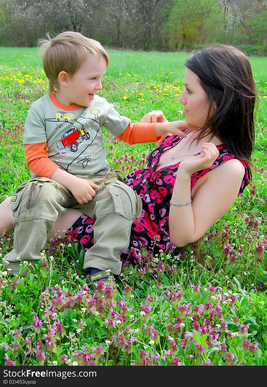 Mum and the son on a walk in park