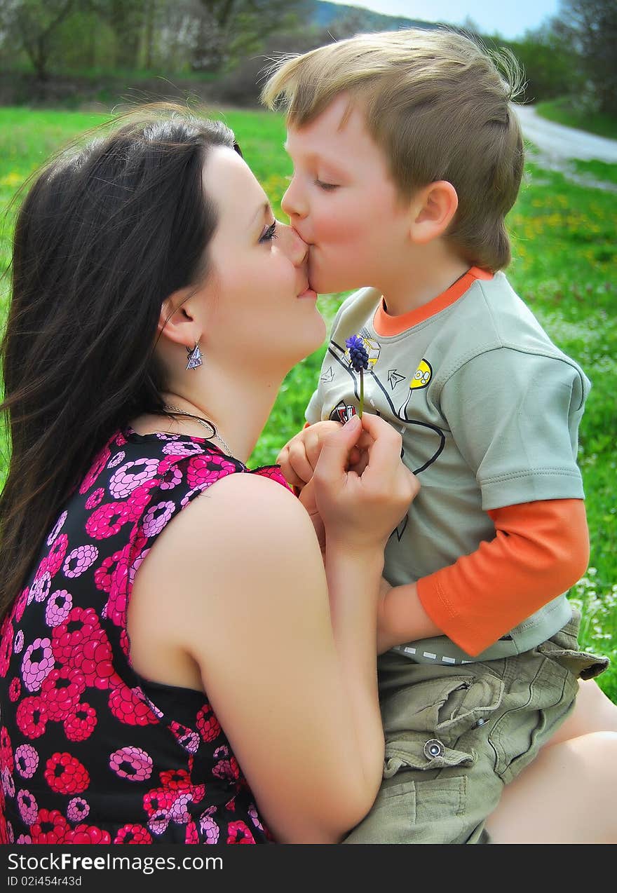 Mum and the son on a walk in a park