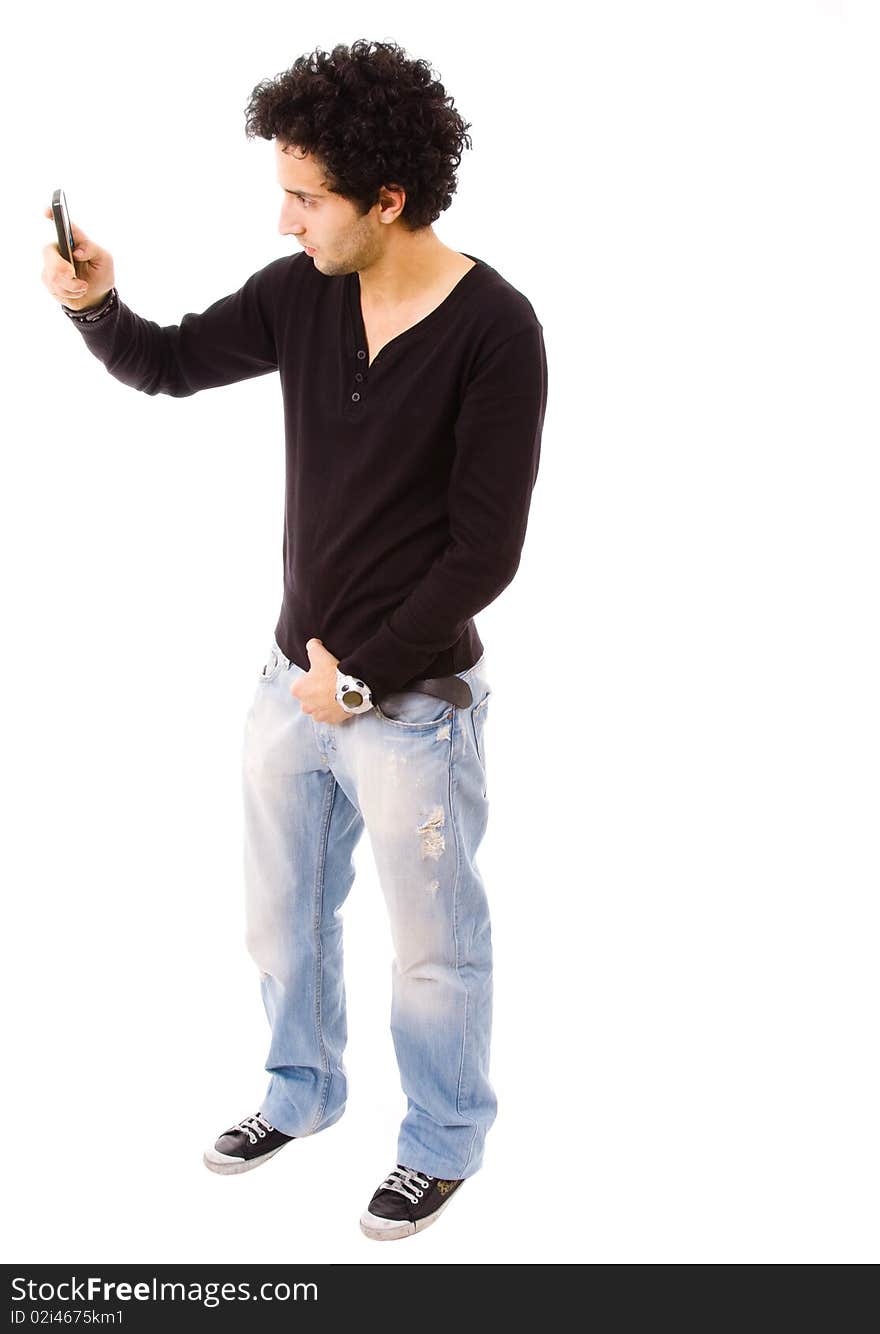 Young casual man using a cellphone to take a picture, isolated on white. Young casual man using a cellphone to take a picture, isolated on white